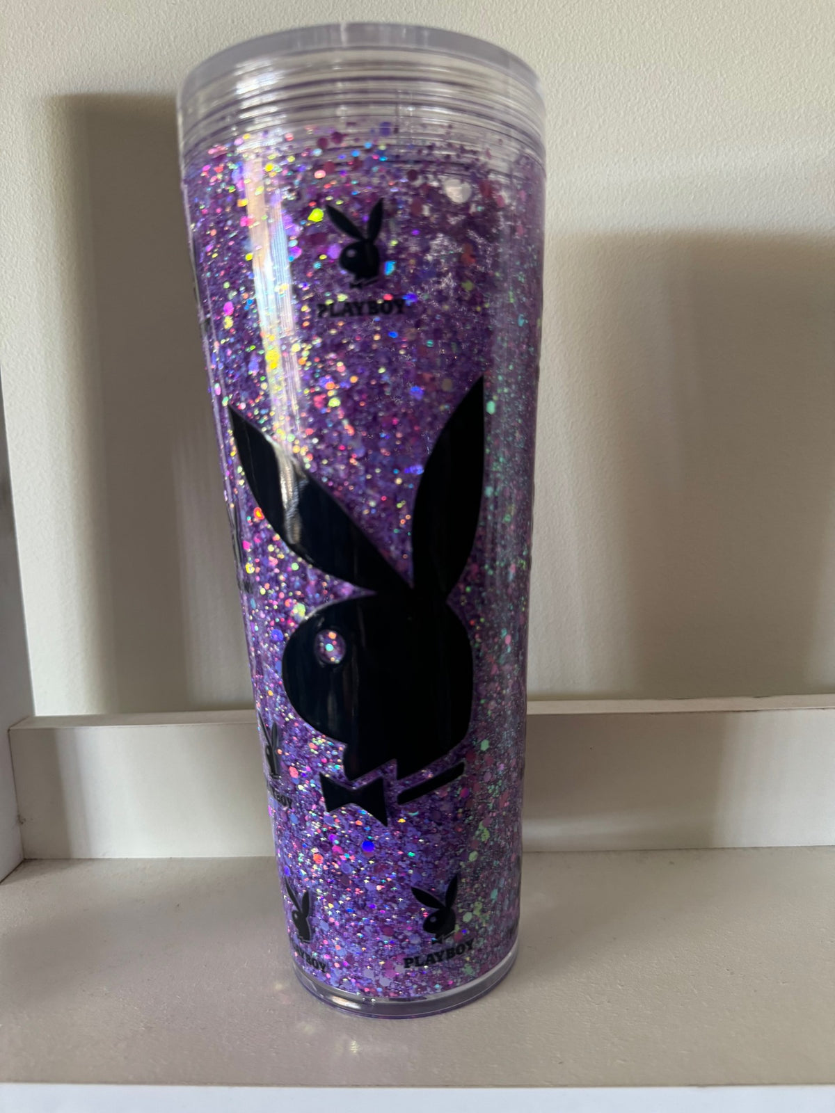 Purple glittery 24oz tumbler with a black Playboy design on a white surface.
Homemade - BH Creations By Me