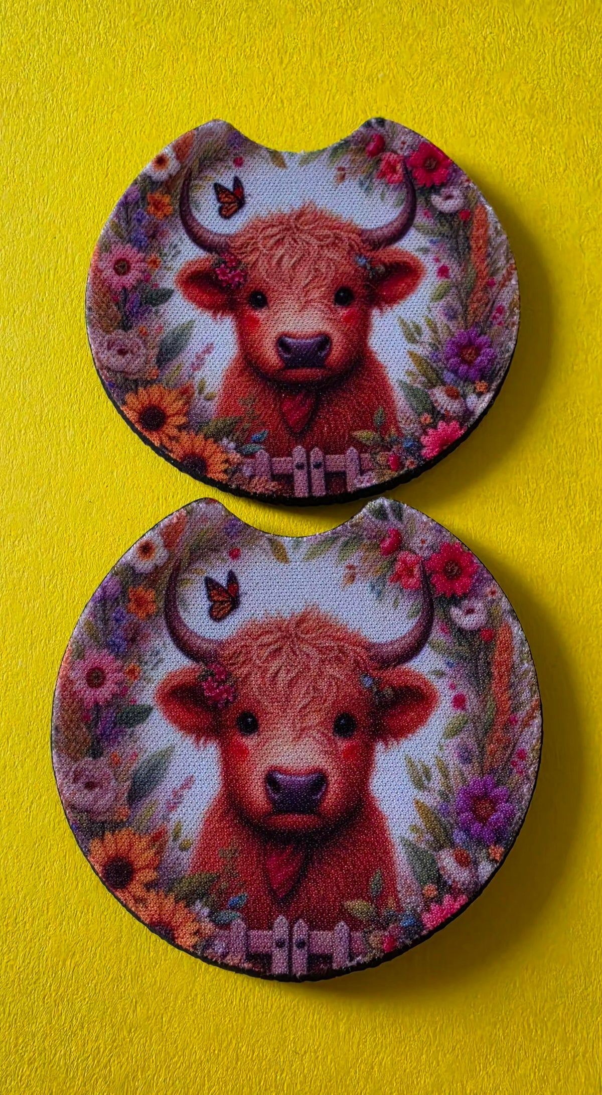 Two round coasters with a cow design on a yellow background.
Homemade - BH Creations By el