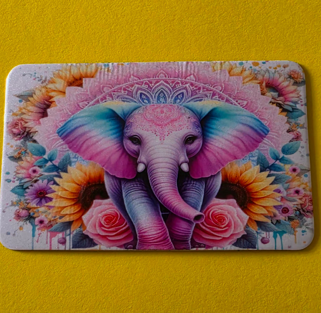 Colorful magnet with an elephant design on a yellow background.
Homemade - BH Creations By Mel