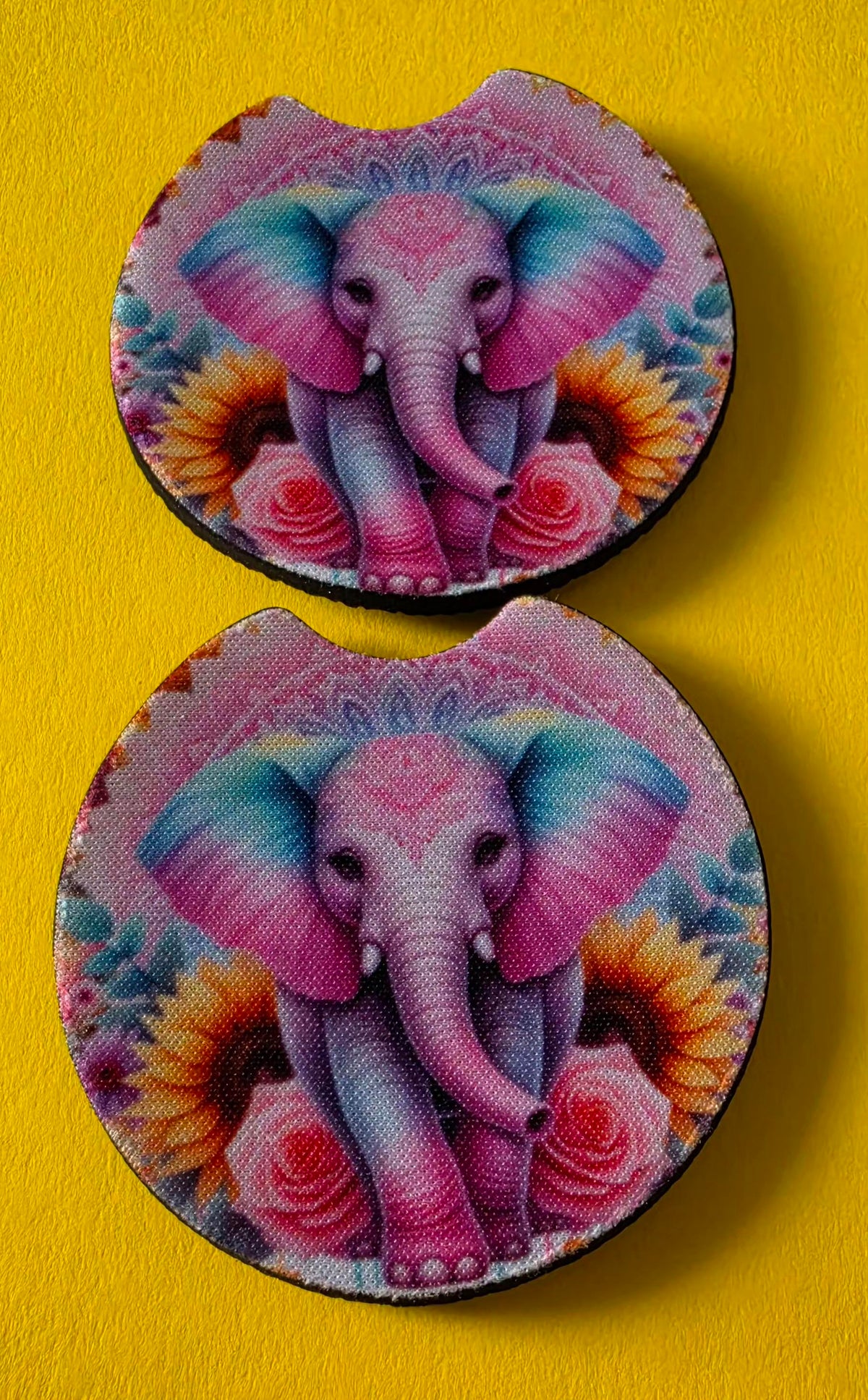 Two circular coasters with a colorful elephant design on a pink background.
Homemade - BH Creations By Mel