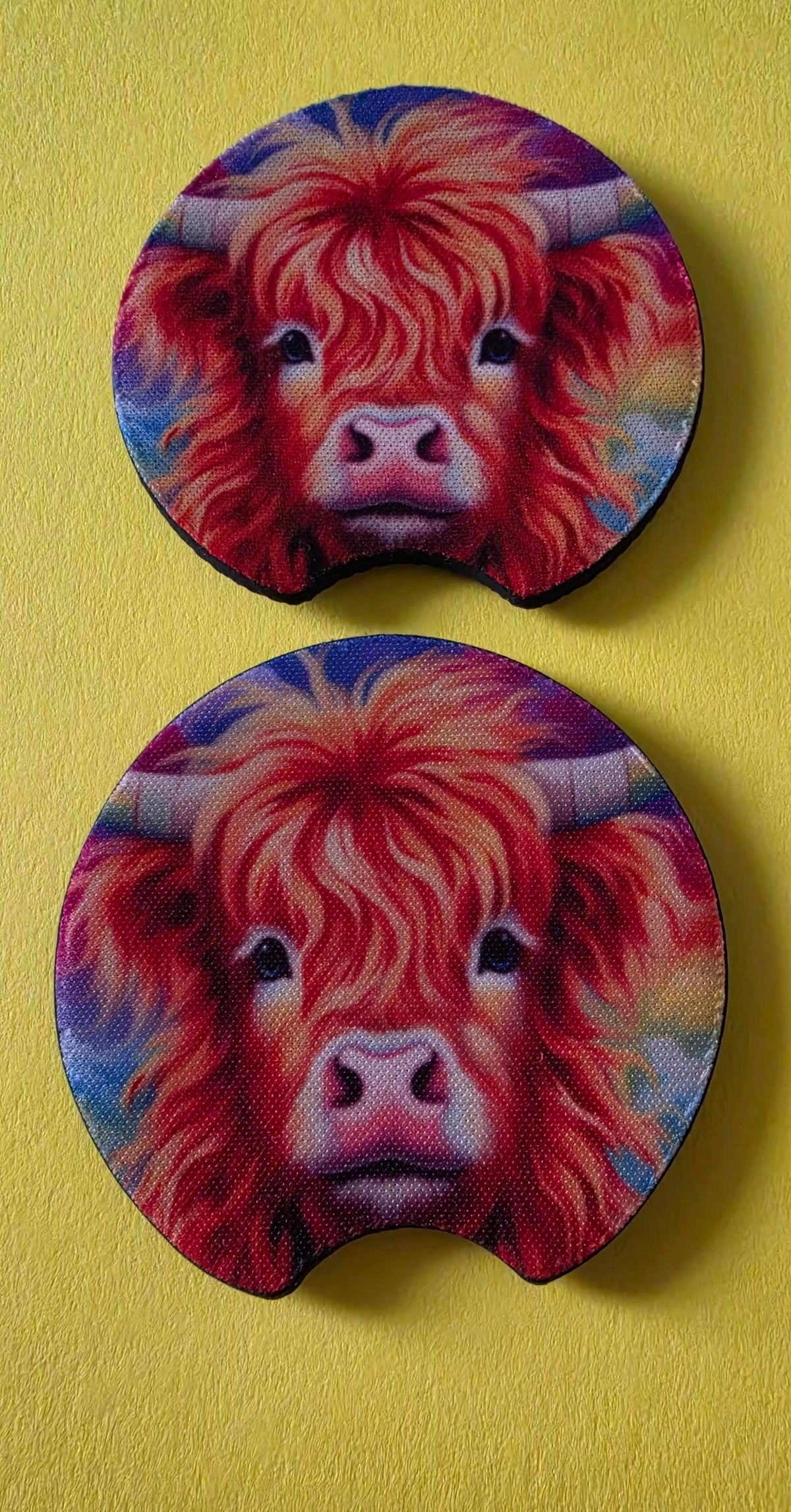 Two round coasters with a colorful highland cow design on a multicolour background.
Homemade - BH Creations By Mel