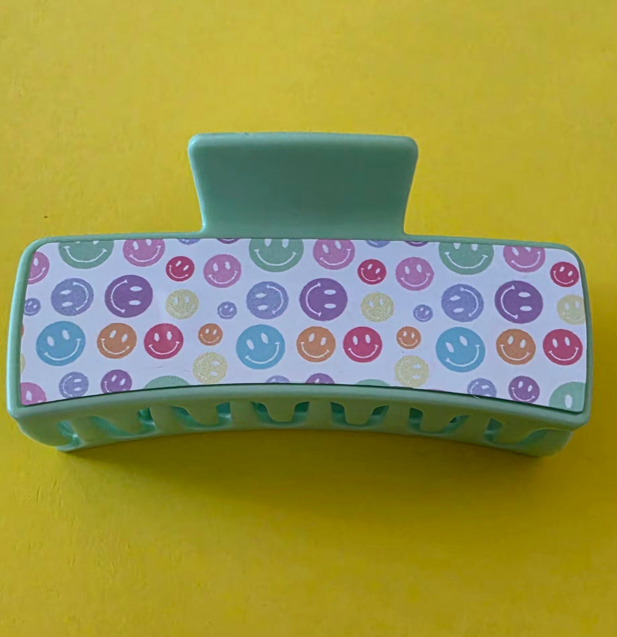 Large Green Claw clip with smiley face pattern on a yellow background.
Homemade - BH Creations By Mel