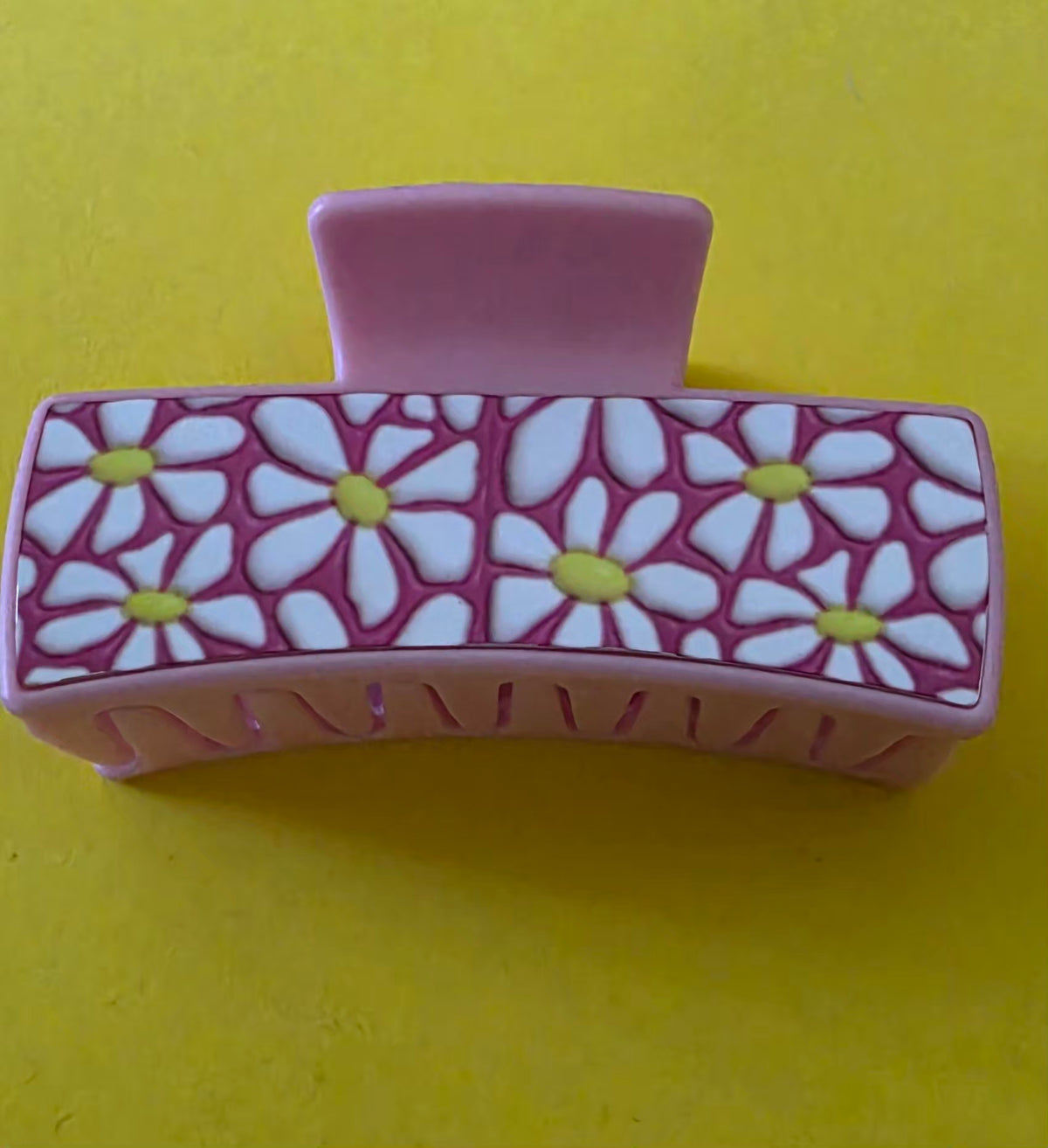 Small Claw clip with white floral pattern on a yellow background